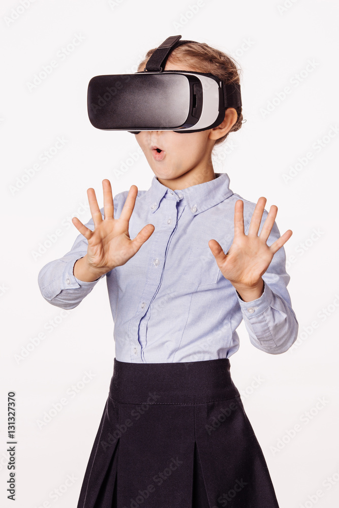 schoolgirl with virtual reality headset. Innovation technology a schoolgirl with virtual reality headset. Innovation technology a
