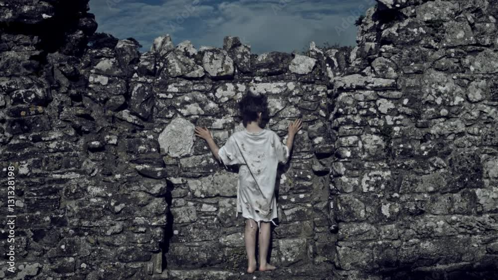 4k Horror Shot of an Abandoned Child Trying to Find the Way out a Stone Wall 4k Horror Shot of an Abandoned Child Trying to Find the Way out a Stone Wall