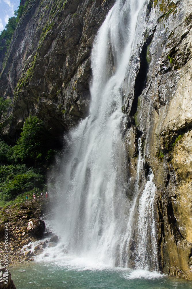 Huge Gegsky waterfall flowing from the cliff. Abkhazia
