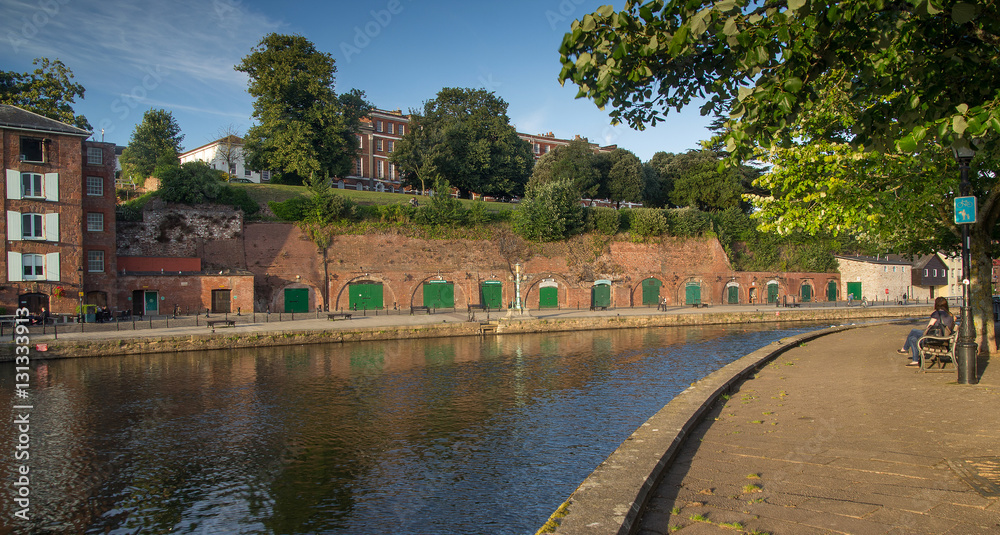 Fototapeta premium cellars and houses on Exeter Quay. Exe river. Devon. UK