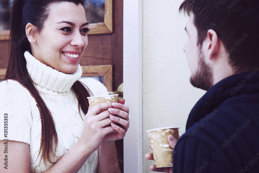 Holidays, winter, christmas, hot drinks and people concept - hap Holidays, winter, christmas, hot drinks and people concept - hap