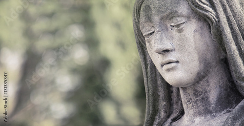 Statue of Virgin Mary in tears (sadness, regret, fear, faith, re