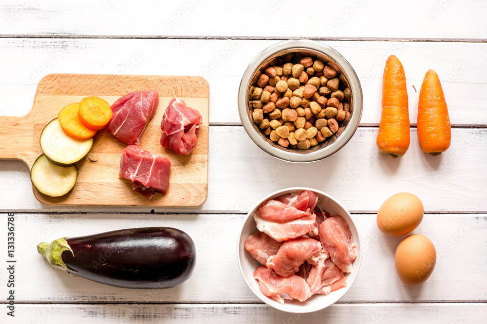 ingredients for pet food holistic top view on wooden background