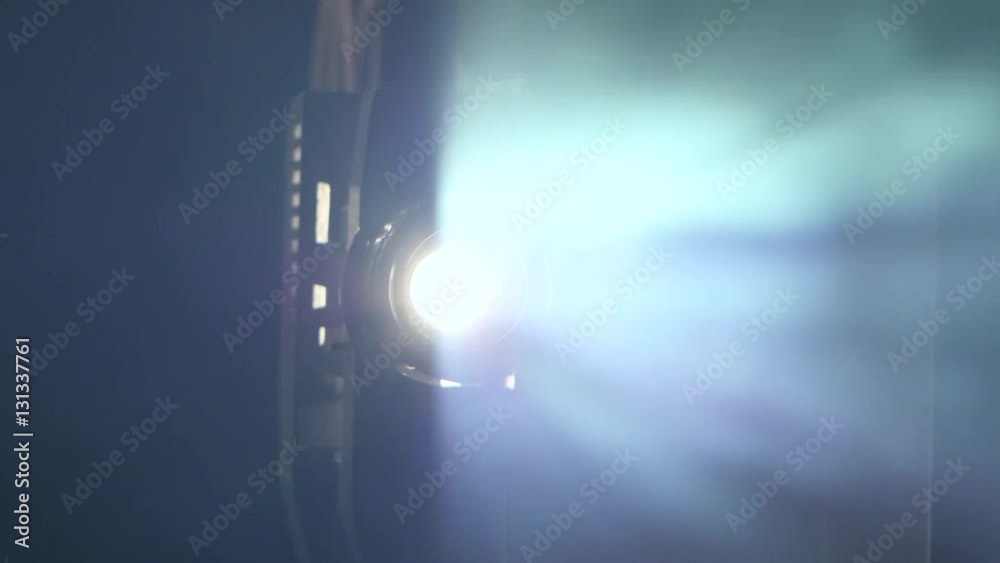 Moving away from objective lens film projector. Close up