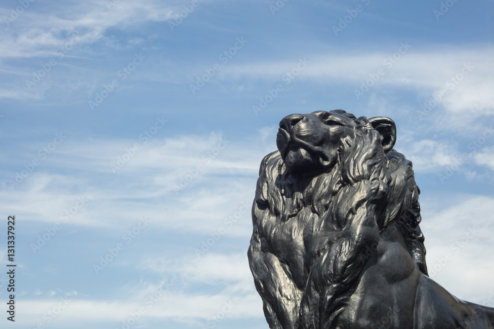Detail of statue of a king lion, which belongs to Christopher Columbus Monument in Barcelona, Spain Detail of statue of a king lion, which belongs to Christopher Columbus Monument in Barcelona, Spain