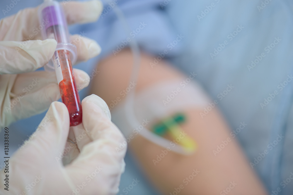 Vial of blood taken from patient's arm Vial of blood taken from patient's arm