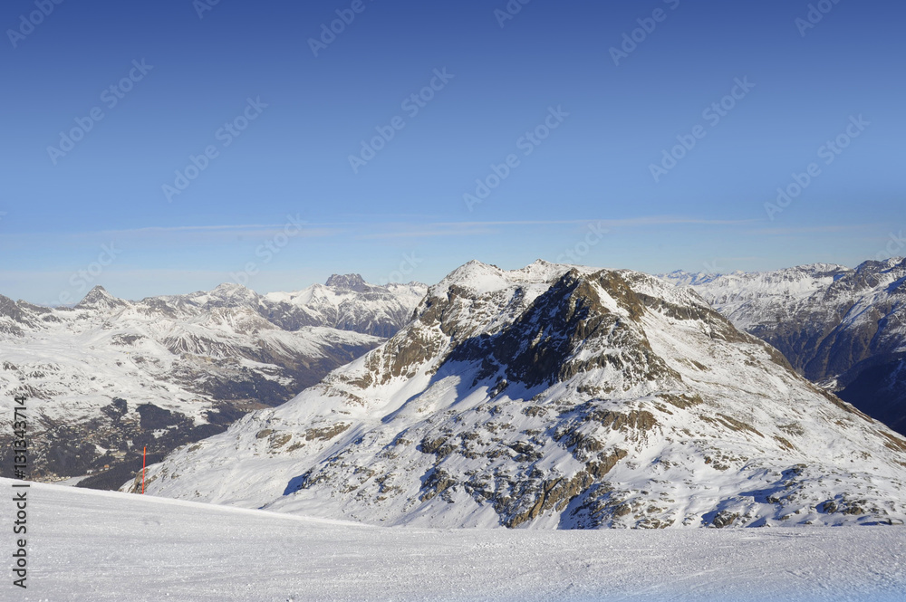  view of snow mountains and ski slope in Switzerland Europe on a cold sunny day