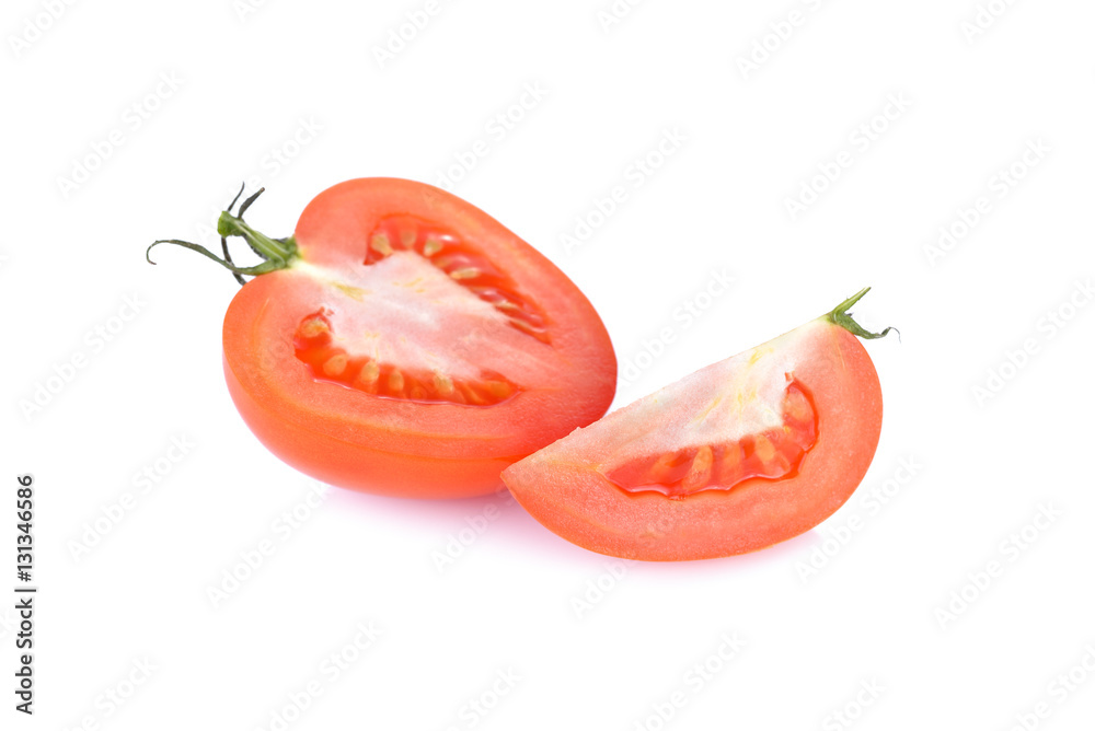 half and portion cut fresh tomato on white background half and portion cut fresh tomato on white background