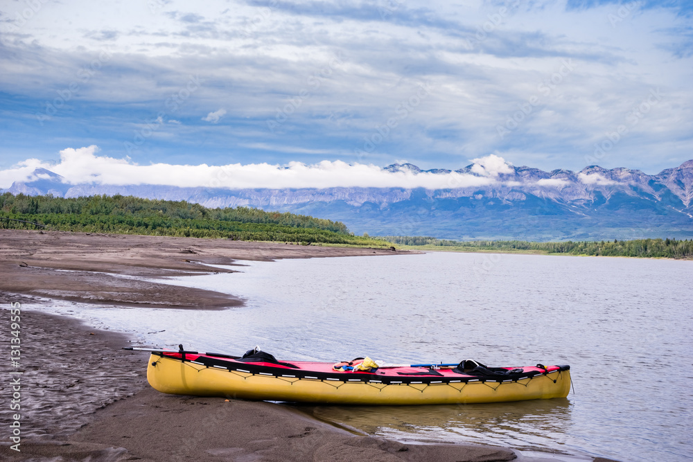 Canoeing Liard river downstream of Nahanni Butte village