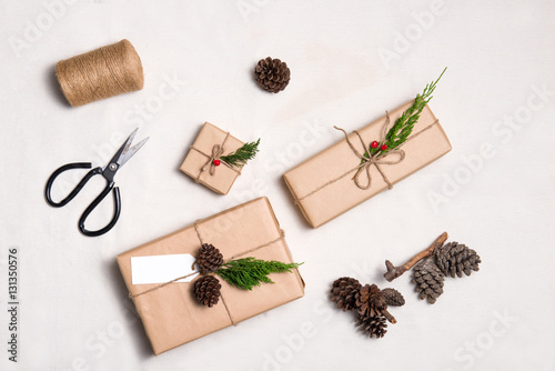 Christmas presents. Packages wrapped in kraft paper tied with ju