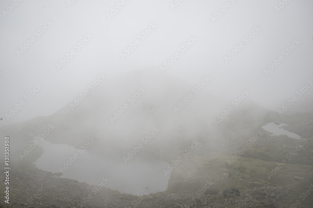 Fototapeta premium Beautiful mountain lake surrounded by impressive mountains of th