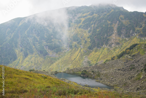 Beautiful mountain lake surrounded by impressive mountains of th photo