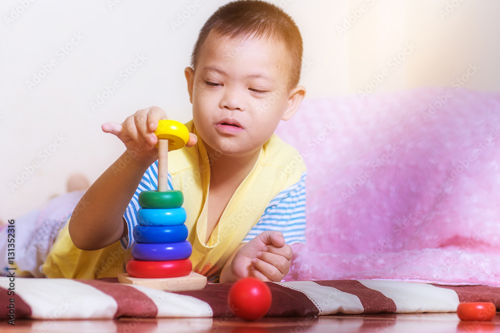 Little boy play color wooden toy at home Little boy play color wooden toy at home