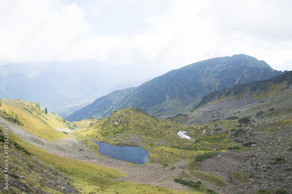 Beautiful mountain lake surrounded by impressive mountains of th