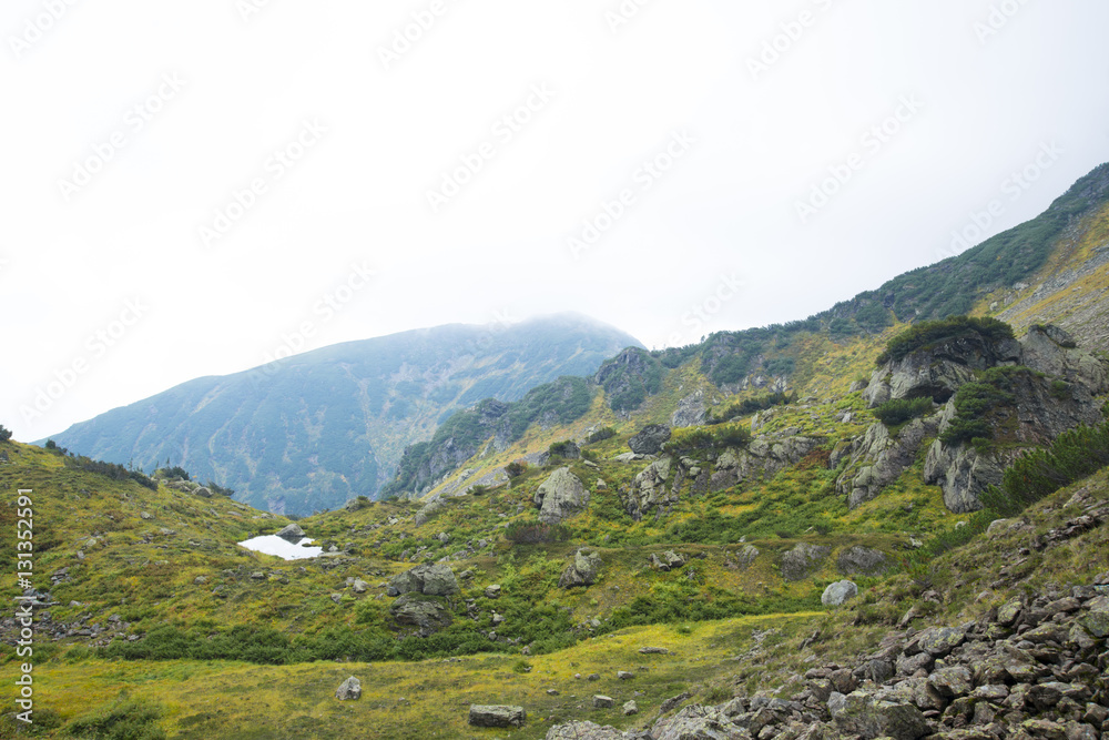 Beautiful mountain lake surrounded by impressive mountains of th Beautiful mountain lake surrounded by impressive mountains of th