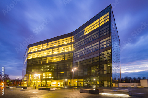 Office building with glass facade,Modern office building in the evening