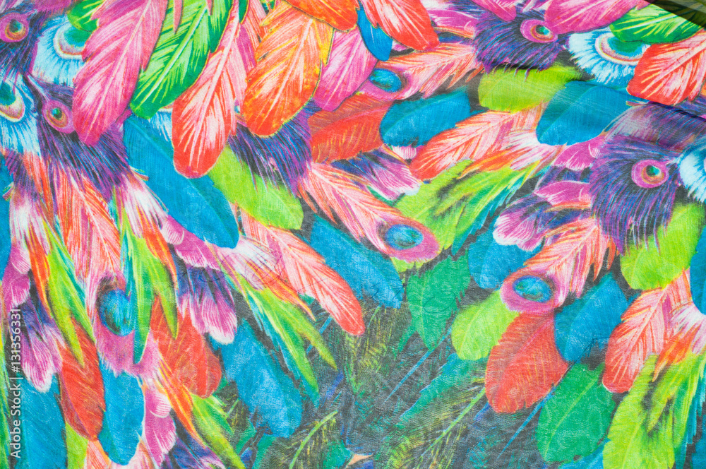 texture of silk fabric. background. colorful fairy feathers bird