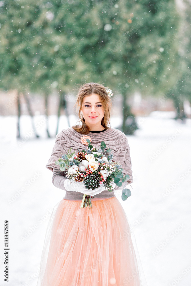 Beautiful bride in a pink dress. Winter wedding. Beautiful bride in a pink dress. Winter wedding.