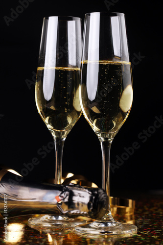 Conceptual Golden Brown Wine on Elegant Glass with Spiral Thin Wrapping Foils or Laces Decoration, on Abstract Brown Background.