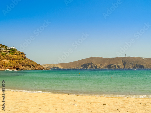 Ftelia beach under the blue sky in Mykonos, Greece © vbjunior