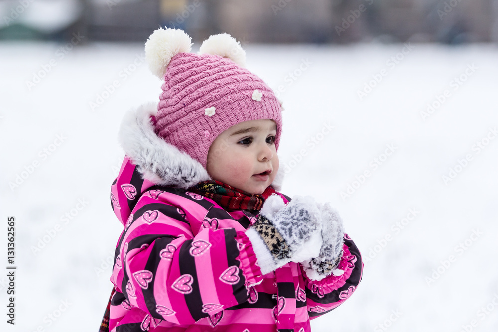 Cute little girl having fun outdoor on nature at winter. Cute little girl having fun outdoor on nature at winter.