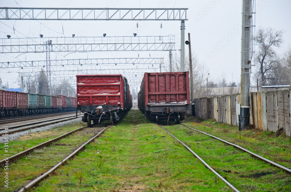 View on railroad tracks and cargo train View on railroad tracks and cargo train