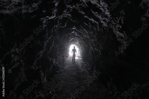 Man explores a cave