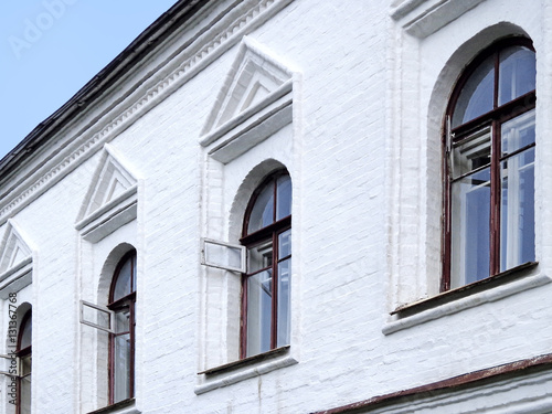 Windows on the white wall of the house