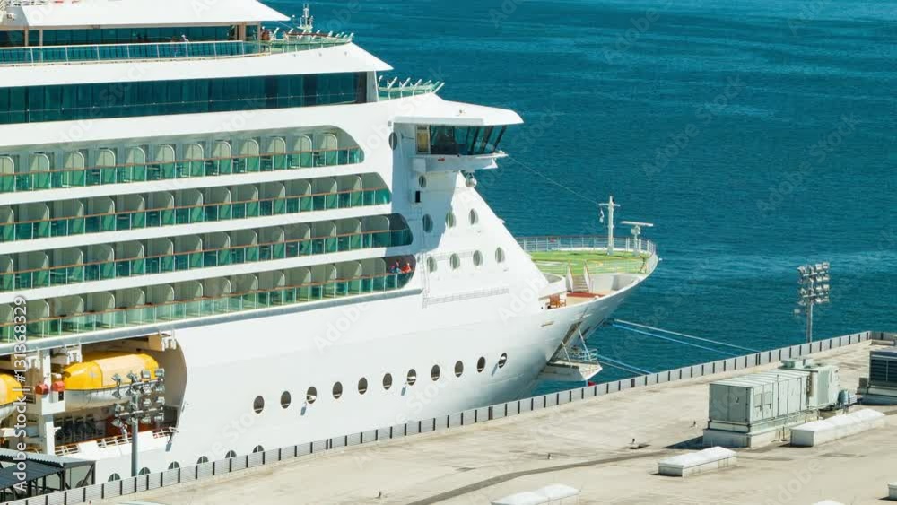 Generic Unmarked Modern Passenger Cruise Ship Docked Against a Pier on a Sunny Day