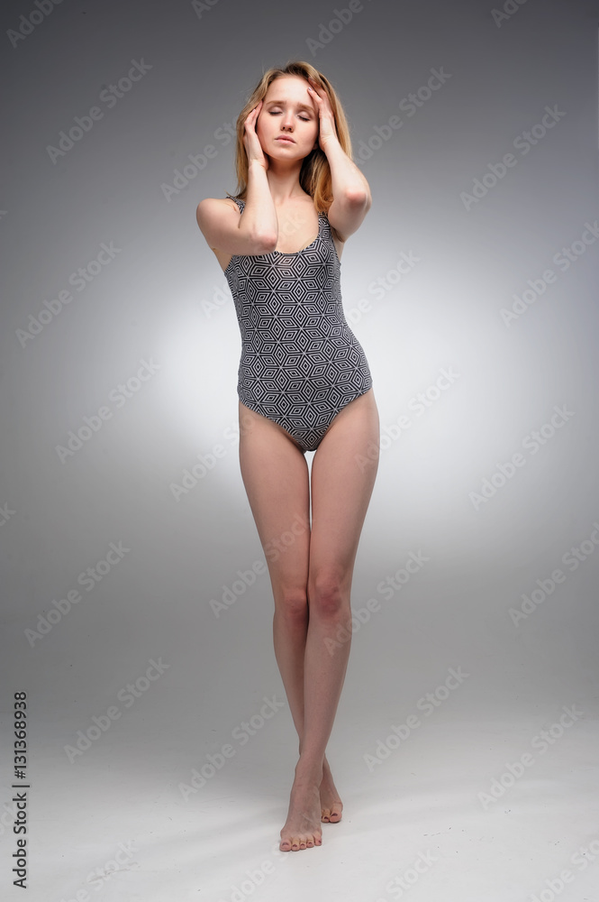 Portrait of attractive young woman with surprised emotion over grey background Portrait of attractive young woman with surprised emotion over grey background