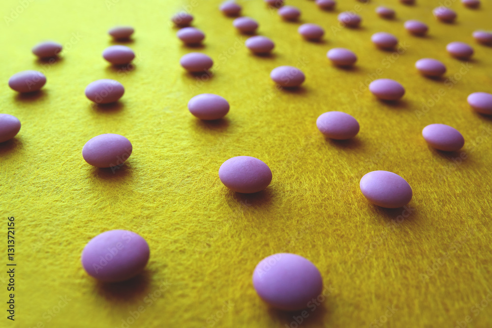 medical pills pattern on yellow background with perscpective medical pills pattern on yellow background with perscpective