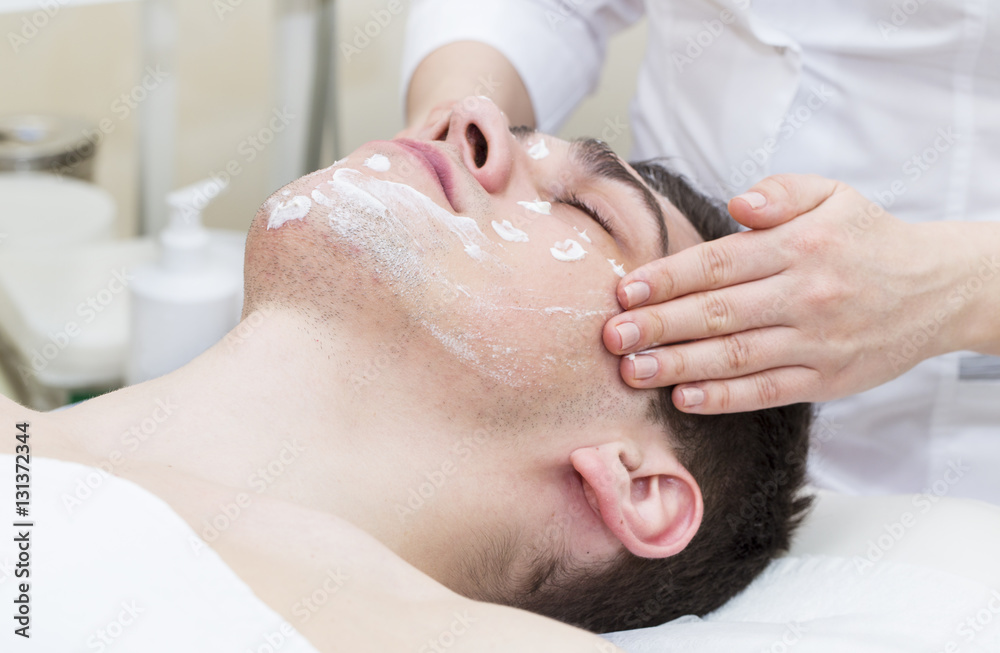 Man in the mask cosmetic procedure in spa salon Man in the mask cosmetic procedure in spa salon