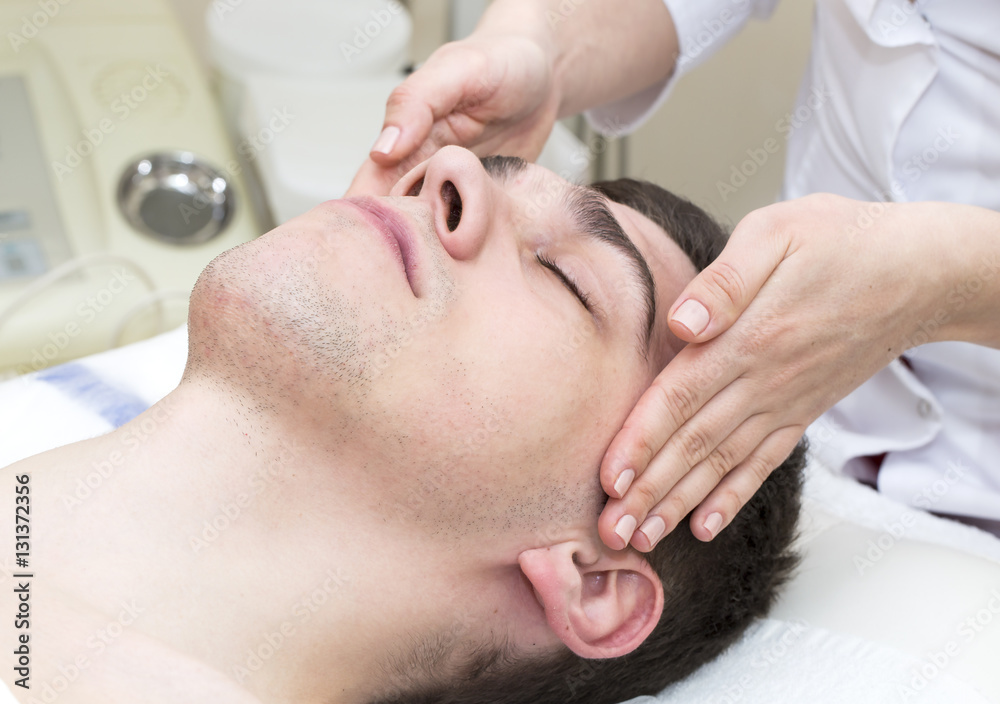 Man in the mask cosmetic procedure in spa salon Man in the mask cosmetic procedure in spa salon