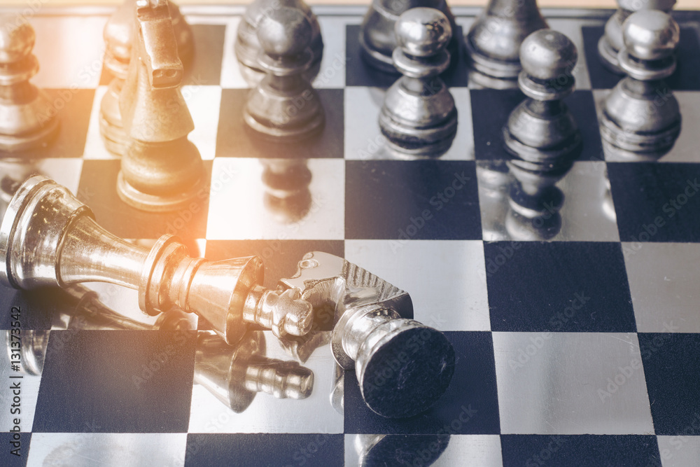 playing chess game on the chess board the concept image of business playing chess game on the chess board the concept image of business