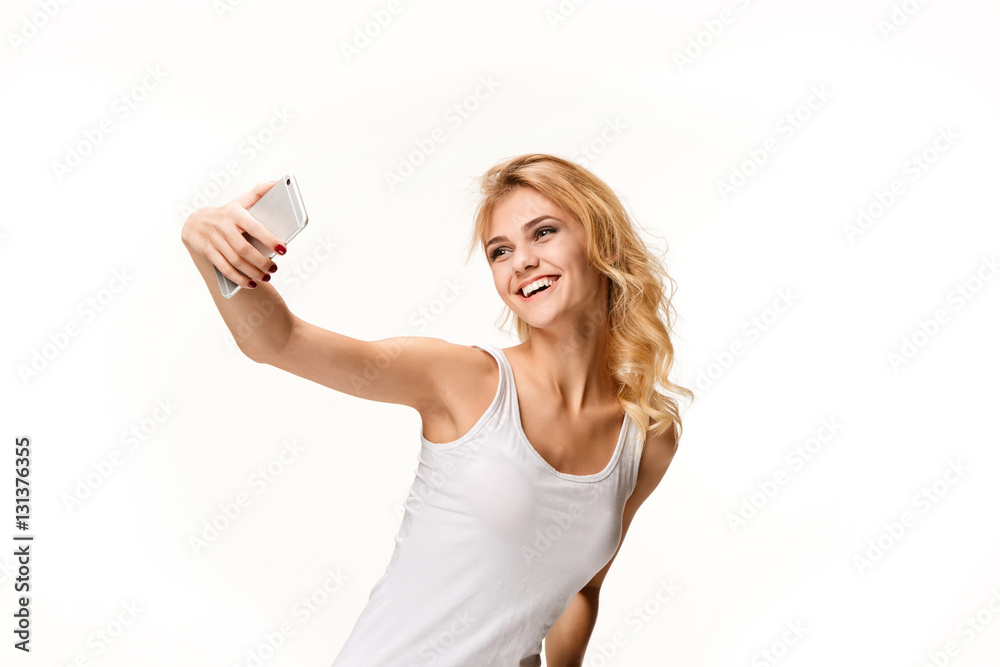 Portrait of beautiful smiling girl with modern l phone Portrait of beautiful smiling girl with modern l phone