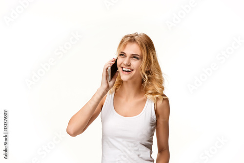 Portrait of beautiful smiling girl with modern l phone