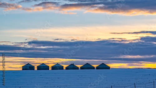Wheat Storage Bins in a Cold Winter Sunset 