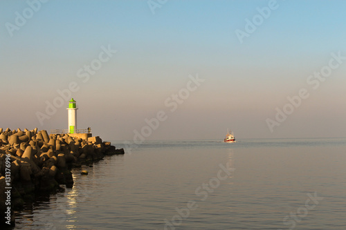 Wallpaper Mural Small fishing boat entering the port Torontodigital.ca