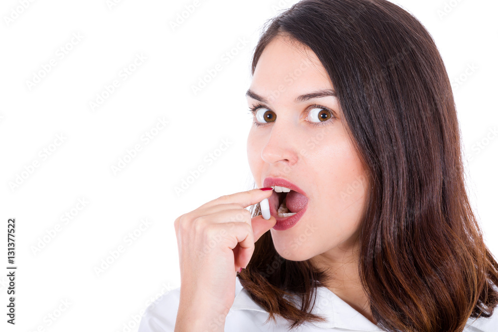 woman takes capsule in mouth isolated on white woman takes capsule in mouth isolated on white