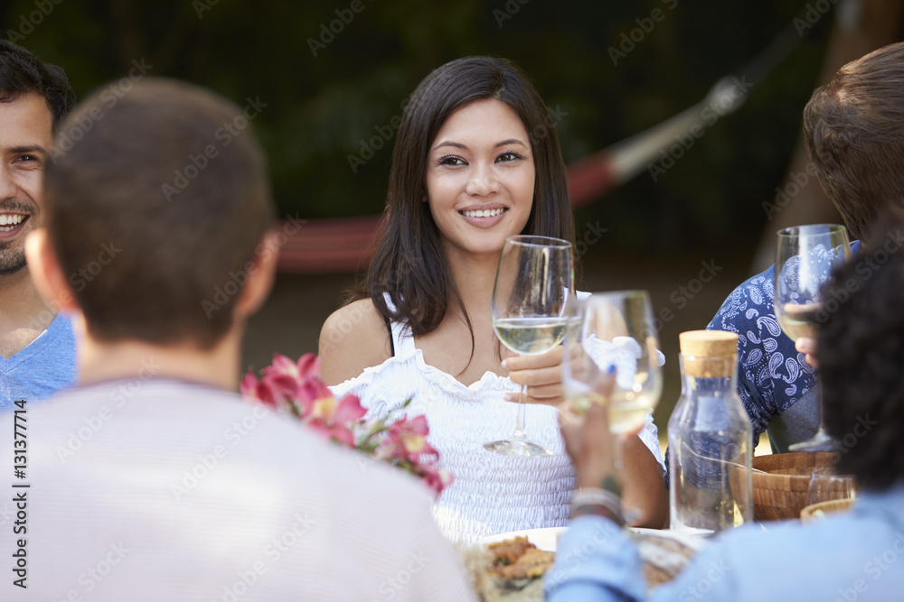 Young Woman Enjoying Outdoor Backyard Party With Friends