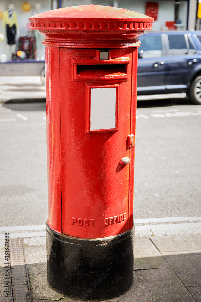 Typical English mailbox on a street in England Typical English mailbox on a street in England