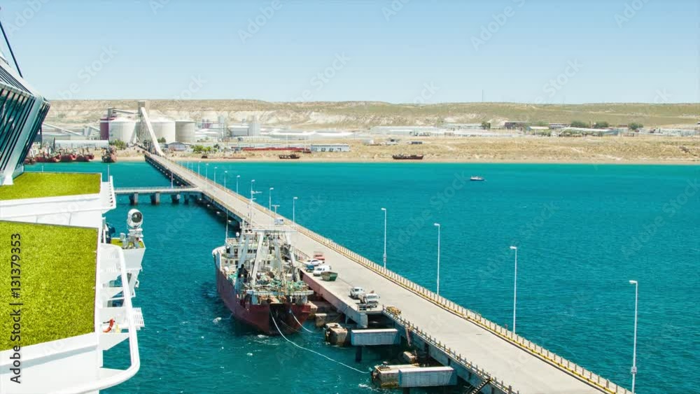 Port of Puerto Madryn Argentina from Cruise Ship with the Long Pier Road Connecting to Land Port of Puerto Madryn Argentina from Cruise Ship with the Long Pier Road Connecting to Land