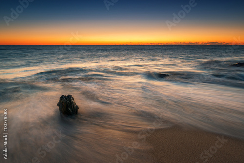 Lone piling long exposure seascape sunrise 