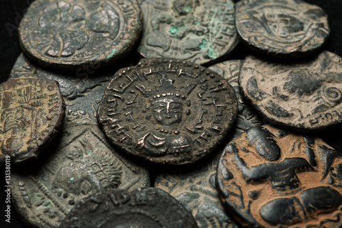 Pile of ancient islamic bronze coins close-up shot