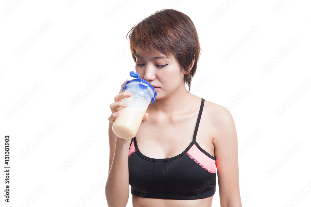 Beautiful Asian healthy girl drinking whey protein. Beautiful Asian healthy girl drinking whey protein.