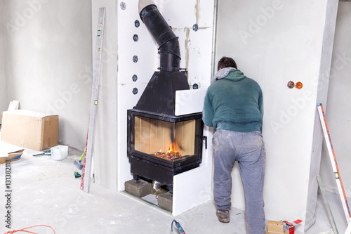 Fireplace installing. Fireplace made from Calcium Silicate Fire Protective Board photo