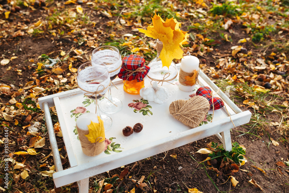 Fototapeta premium tray with a bottle of wine, jam. Autumn decor