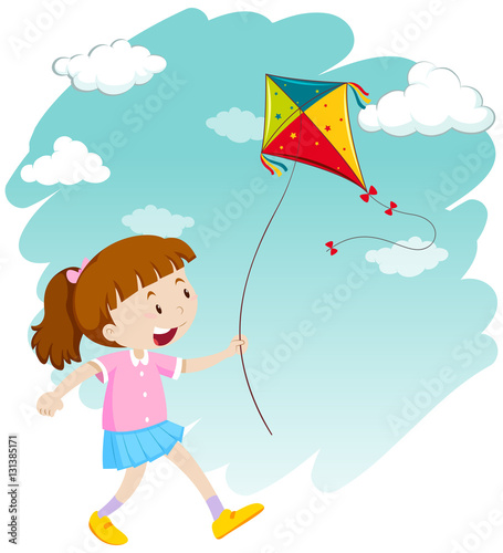 Little girl playing kite