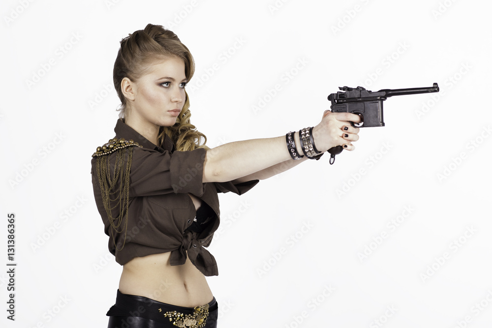 Side view portrait of young woman pointing mauser handgun Side view portrait of young woman pointing mauser handgun