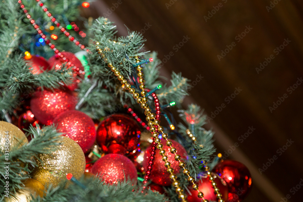closeup christmas tree with decorative balls and garland